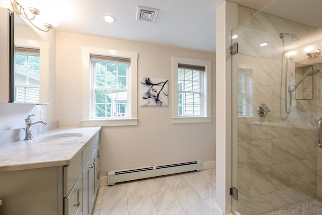 134 W Bacon St, Plainville, MA 02762 - bathroom with a baseboard heating unit, vanity, and plenty of natural light