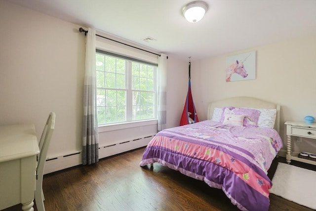 134 W Bacon St, Plainville, MA 02762 - bedroom with wood finished floors and a baseboard heating unit
