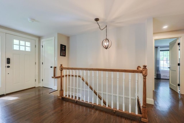 134 W Bacon St, Plainville, MA 02762 - foyer with wood finished floors and baseboards