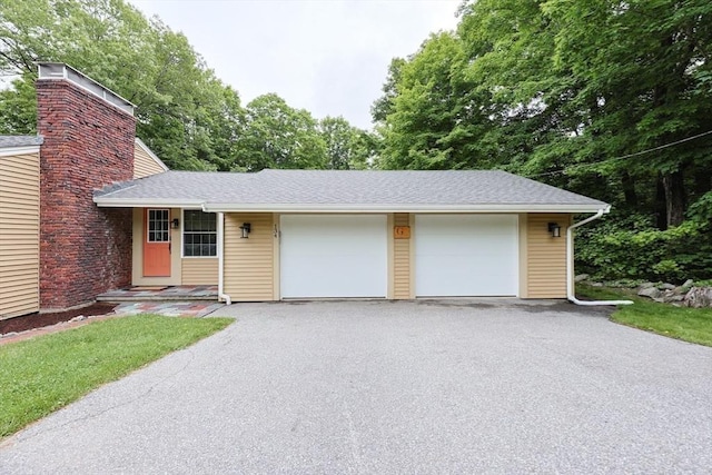 134 W Bacon St, Plainville, MA 02762 - view of front facade with asphalt driveway, an attached garage, and a shingled roof