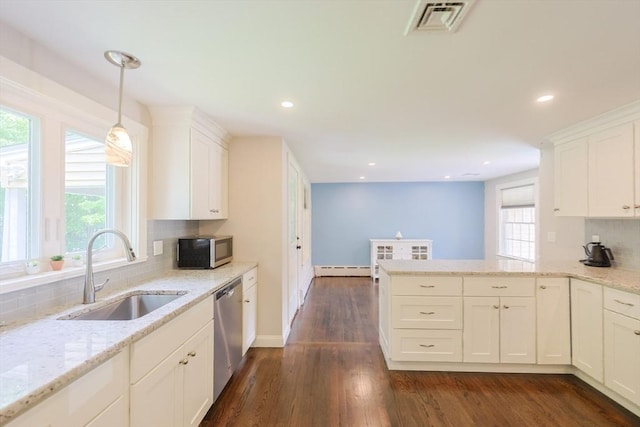 134 W Bacon St, Plainville, MA 02762 - kitchen featuring a sink, stainless steel appliances, backsplash, a baseboard heating unit, and recessed lighting