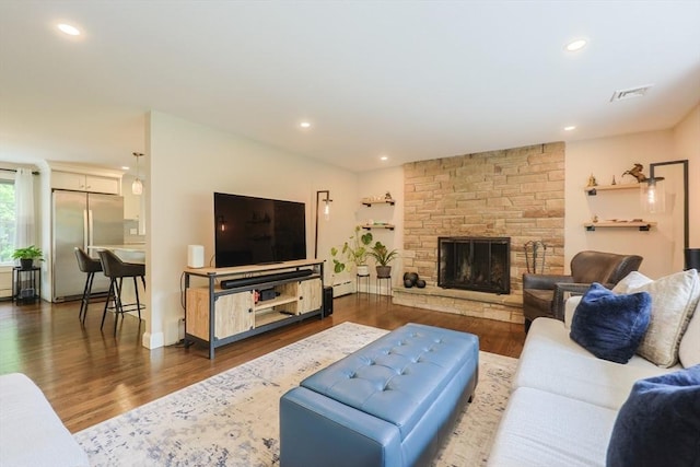 134 W Bacon St, Plainville, MA 02762 - living room with wood finished floors, recessed lighting, a fireplace, a baseboard heating unit, and baseboards