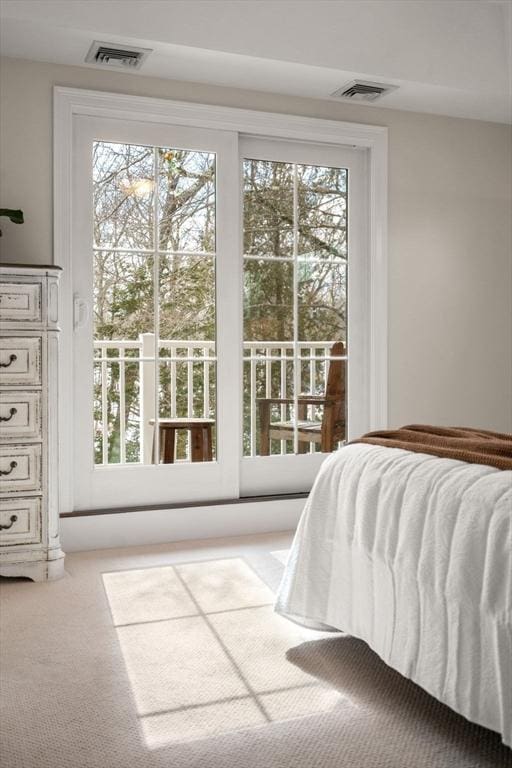 carpeted bedroom with visible vents