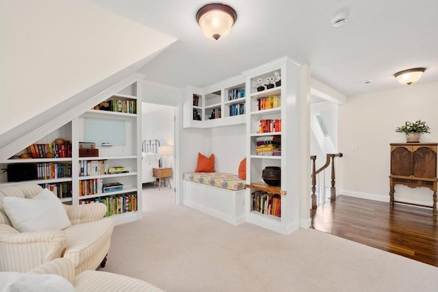 living area with carpet and baseboards