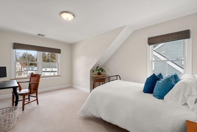 bedroom featuring light carpet, visible vents, and baseboards