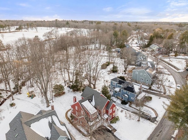 snowy aerial view with a residential view