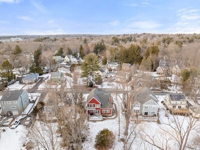 snowy aerial view featuring a residential view