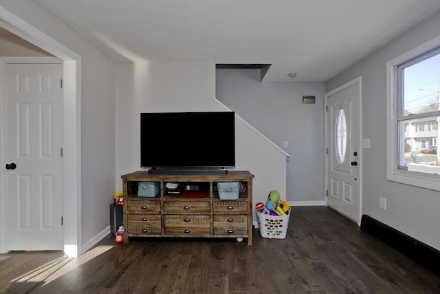 living room with dark hardwood / wood-style floors