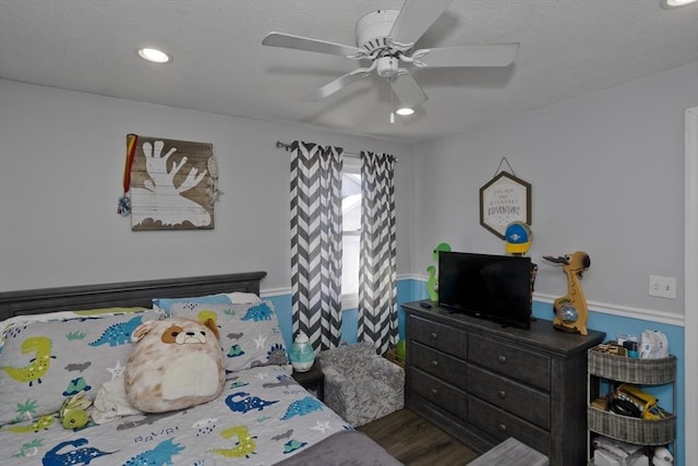 bedroom featuring dark wood-type flooring and ceiling fan