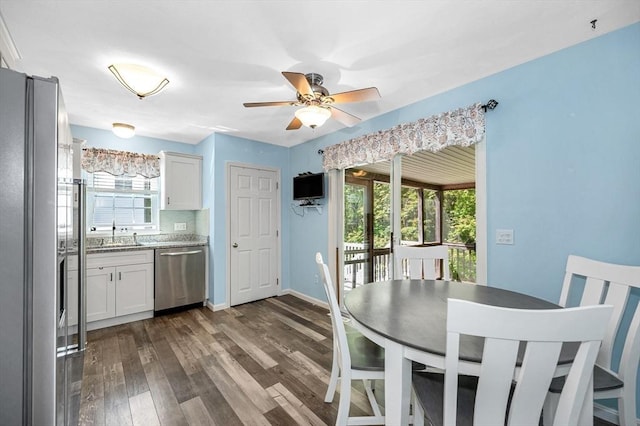 218 Acropolis Rd, Lowell, MA 01854 - dining area featuring dark wood-style floors, ceiling fan, and baseboards