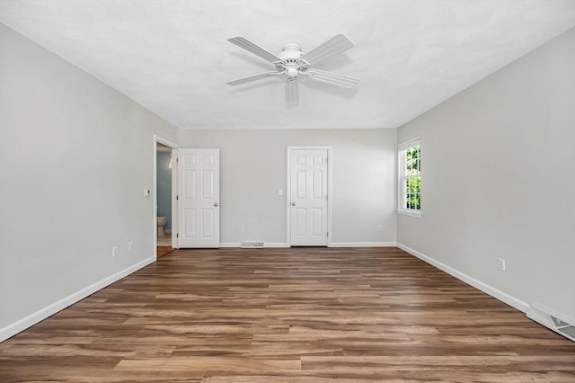 218 Acropolis Rd, Lowell, MA 01854 - unfurnished room featuring wood finished floors, ceiling fan, and baseboards