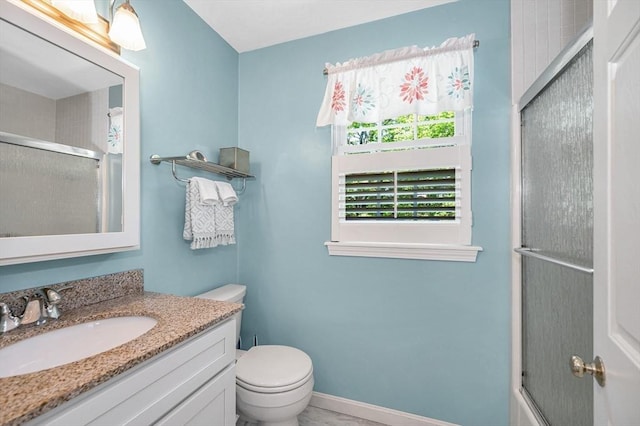 218 Acropolis Rd, Lowell, MA 01854 - full bathroom with vanity, toilet, bath / shower combo with glass door, and baseboards