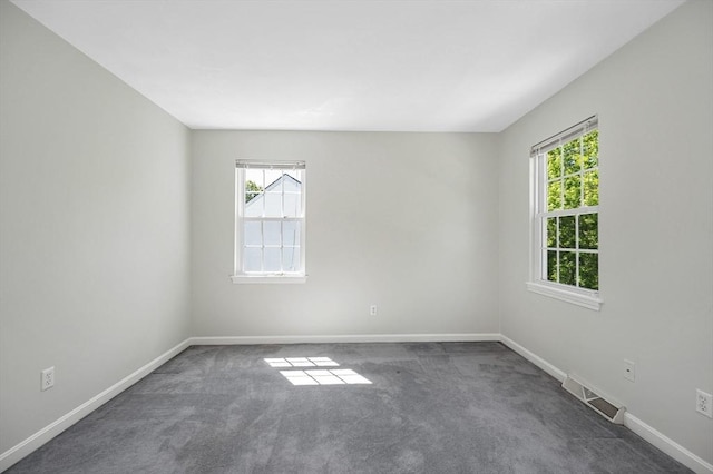 218 Acropolis Rd, Lowell, MA 01854 - unfurnished room featuring healthy amount of natural light, carpet, and baseboards