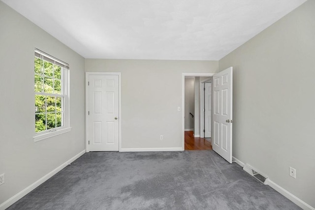 218 Acropolis Rd, Lowell, MA 01854 - unfurnished bedroom with carpet flooring and baseboards