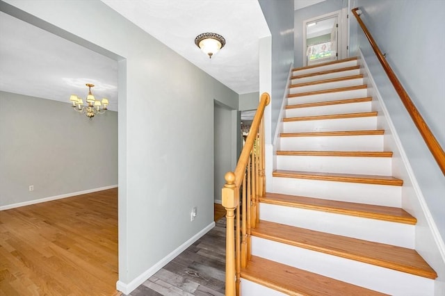 218 Acropolis Rd, Lowell, MA 01854 - staircase with wood finished floors, a chandelier, and baseboards