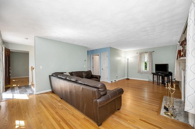 218 Acropolis Rd, Lowell, MA 01854 - living room with baseboards and light wood-type flooring