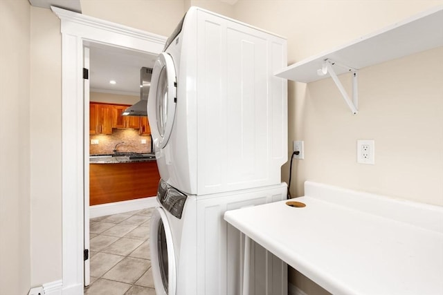 21 Searle Ave Unit 2, Brookline, MA 02445 - laundry room with stacked washer and clothes dryer, light tile patterned flooring, and recessed lighting