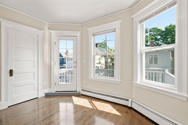 21 Searle Ave Unit 2, Brookline, MA 02445 - entryway with wood finished floors, a baseboard radiator, and crown molding