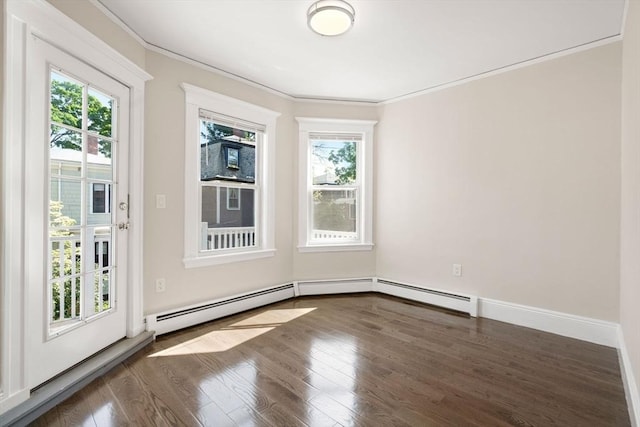 21 Searle Ave Unit 2, Brookline, MA 02445 - empty room featuring plenty of natural light, a baseboard heating unit, ornamental molding, and wood finished floors