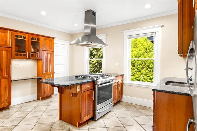 21 Searle Ave Unit 2, Brookline, MA 02445 - kitchen featuring gas stove, island range hood, dark stone countertops, glass insert cabinets, and ornamental molding
