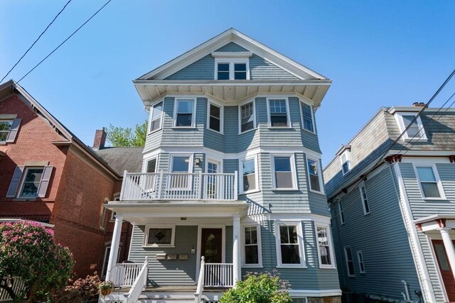 21 Searle Ave Unit 2, Brookline, MA 02445 - view of front facade with a balcony and a porch