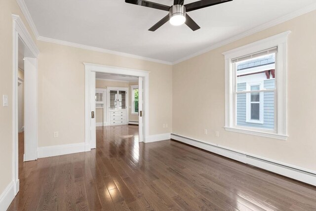 21 Searle Ave Unit 2, Brookline, MA 02445 - spare room featuring a baseboard radiator, ceiling fan, dark wood finished floors, crown molding, and baseboards