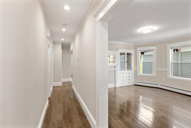 21 Searle Ave Unit 2, Brookline, MA 02445 - hall featuring ornamental molding, wood finished floors, baseboards, baseboard heating, and recessed lighting