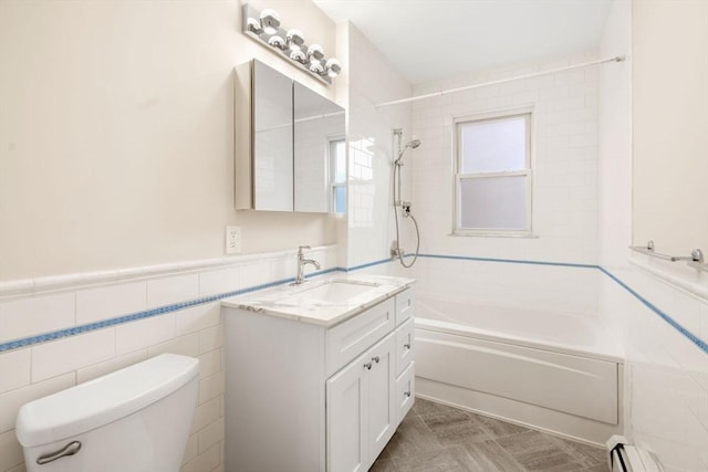 21 Searle Ave Unit 2, Brookline, MA 02445 - full bath featuring bathing tub / shower combination, toilet, tile walls, vanity, and a baseboard heating unit