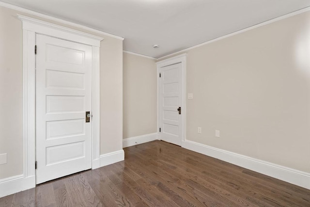 21 Searle Ave Unit 2, Brookline, MA 02445 - spare room with crown molding, baseboards, and dark wood-type flooring