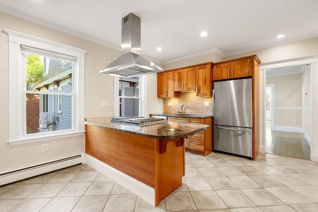 21 Searle Ave Unit 2, Brookline, MA 02445 - kitchen with stainless steel appliances, island exhaust hood, brown cabinets, a baseboard radiator, and a peninsula