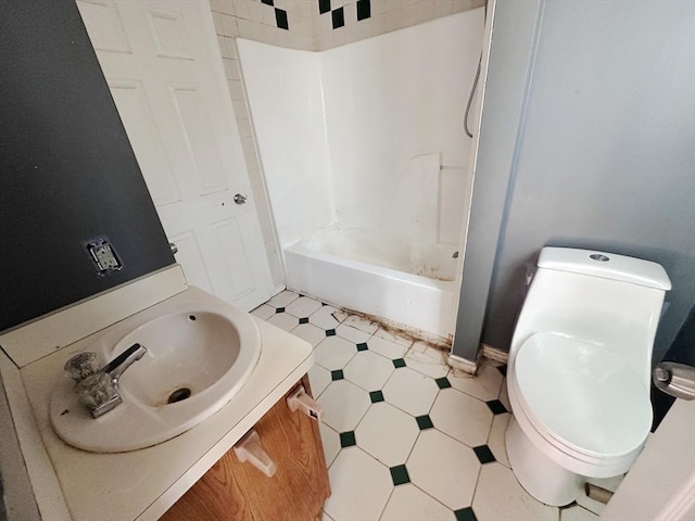 bathroom with tile patterned floors, shower / bathing tub combination, toilet, and vanity