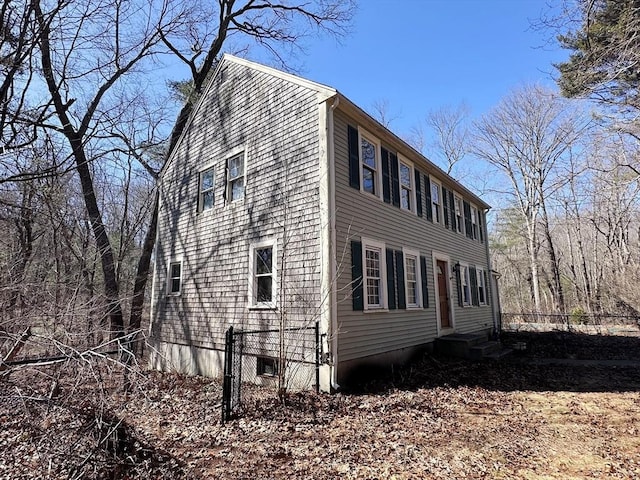 view of side of home featuring entry steps