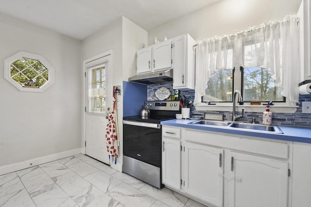 kitchen with white cabinetry, stainless steel electric stove, sink, and backsplash