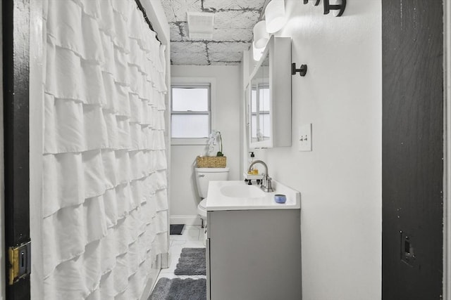 bathroom featuring vanity, a shower with curtain, and toilet