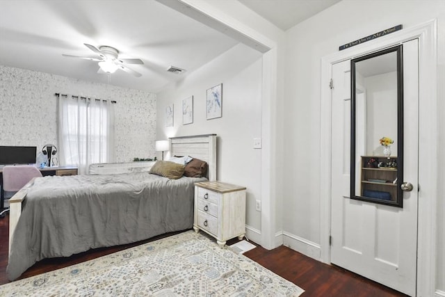 bedroom featuring dark hardwood / wood-style floors and ceiling fan