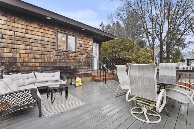 wooden deck with outdoor lounge area