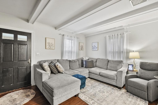 living room featuring hardwood / wood-style floors and beamed ceiling