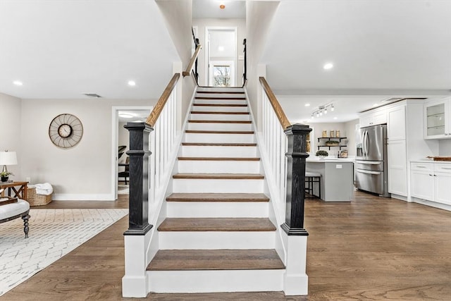 stairs with wood-type flooring