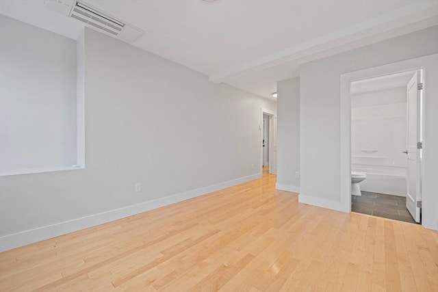 spare room with light hardwood / wood-style floors