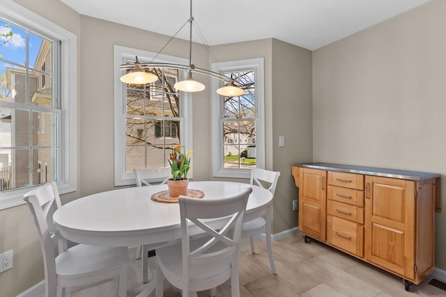 dining room featuring baseboards