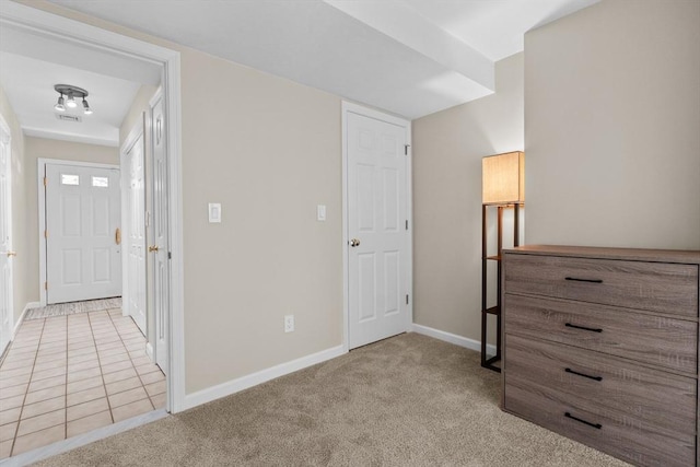 interior space with carpet flooring and baseboards