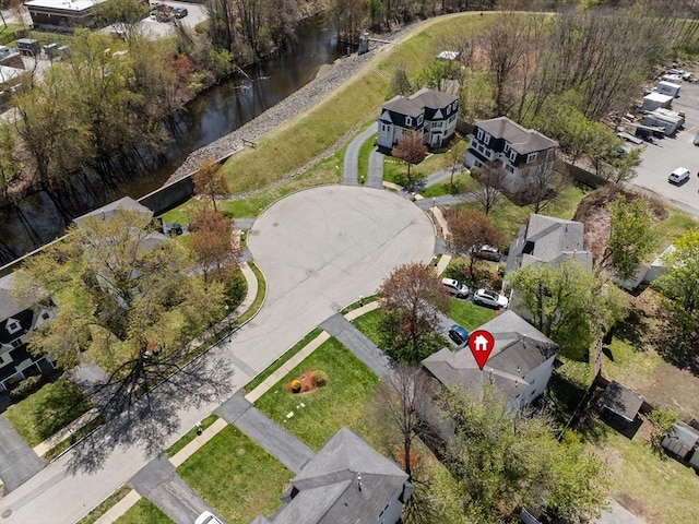 bird's eye view featuring a residential view and a water view