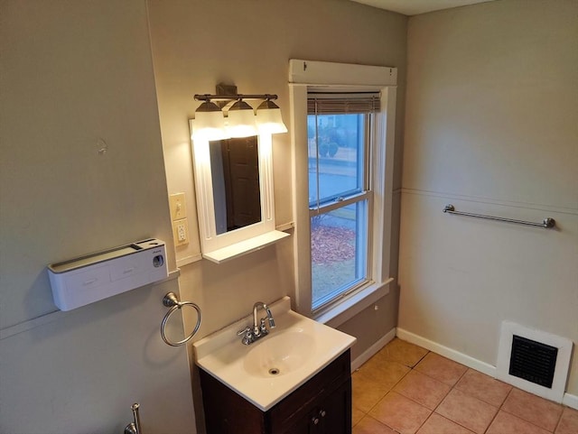 bathroom featuring vanity, tile patterned floors, and a wealth of natural light