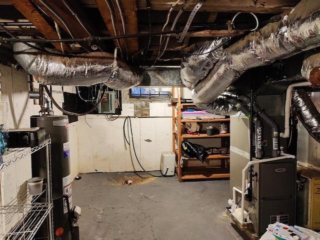 basement with electric panel, heating unit, and water heater