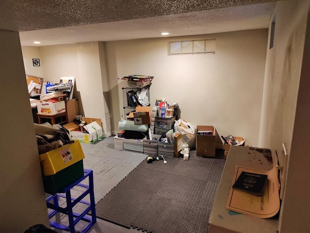 basement featuring a textured ceiling