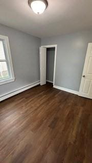 15 York St, Haverhill, MA 01830 - unfurnished bedroom featuring dark wood-style flooring, baseboards, and a closet