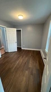 15 York St, Haverhill, MA 01830 - unfurnished bedroom with baseboards and dark wood-style floors