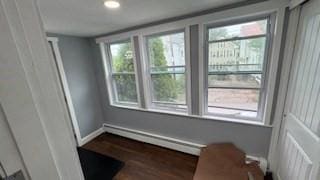 15 York St, Haverhill, MA 01830 - spare room featuring baseboard heating, dark wood-type flooring, plenty of natural light, recessed lighting, and baseboards