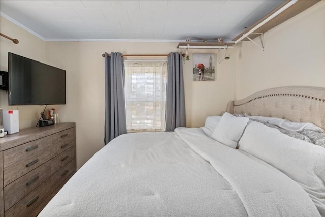 bedroom with ornamental molding