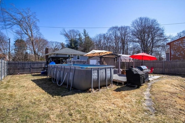 view of yard with a fenced in pool and a fenced backyard